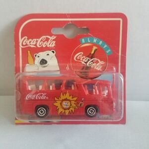 1997 Majorette Metal Coca Cola Red 1:64 Scale Minibus on a Short Card.